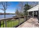Charming back deck overlooking the lake and boat dock, perfect for outdoor relaxation at 106 Nashua Cv, Louisburg, NC 27549