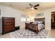 Cozy bedroom with a classic bed frame, dresser, and ample natural light filtering through the windows at 106 Nashua Cv, Louisburg, NC 27549