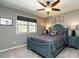 Serene bedroom with gray walls, plush carpeting, and large window for natural light at 106 Nashua Cv, Louisburg, NC 27549