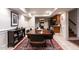 Comfortable dining space featuring a wooden table and seating for six, adjacent to a kitchen area at 106 Nashua Cv, Louisburg, NC 27549