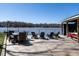 Inviting dock seating area with a dining table and chairs, ideal for waterfront dining at 106 Nashua Cv, Louisburg, NC 27549