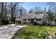Charming home exterior with well-manicured lawn and circular driveway near a lake at 106 Nashua Cv, Louisburg, NC 27549