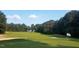 Expansive golf course vista, with a glimpse of a charming home in the distance at 106 Nashua Cv, Louisburg, NC 27549