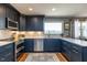 Beautiful kitchen boasts stainless steel appliances, quartz countertops, and ample storage at 106 Nashua Cv, Louisburg, NC 27549