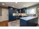 Stunning kitchen with stainless steel appliances, marble countertops and large island at 106 Nashua Cv, Louisburg, NC 27549
