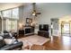 Bright living room featuring high ceilings, brick fireplace, and comfortable seating at 106 Nashua Cv, Louisburg, NC 27549