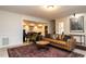 Relaxing living room area with stylish decor, a leather couch, and plenty of space for entertaining at 106 Nashua Cv, Louisburg, NC 27549