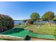 Fun mini-golf course, surrounded by lush greenery and a beautiful lake at 106 Nashua Cv, Louisburg, NC 27549