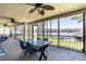 The back patio showcases an outdoor dining area and views of the lake at 106 Nashua Cv, Louisburg, NC 27549