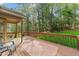Inviting wooden deck overlooking a lush green backyard, perfect for outdoor relaxation and entertaining at 1208 Turner Farms Rd, Garner, NC 27529