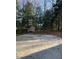 Backyard featuring a basketball court and storage shed, offering recreational opportunities and storage space at 1208 Turner Farms Rd, Garner, NC 27529