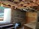Exposed basement with access to the outside, revealing brick and cinder block construction at 1208 Turner Farms Rd, Garner, NC 27529