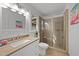 Well-lit bathroom featuring a glass-enclosed shower and granite countertops at 1208 Turner Farms Rd, Garner, NC 27529