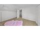 Bedroom with bright colors, a fluffy pink carpet, and a cute baby crib at 1208 Turner Farms Rd, Garner, NC 27529