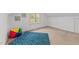 Bedroom with a cozy and colorful setup with a blue carpet and toys at 1208 Turner Farms Rd, Garner, NC 27529