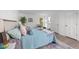 Bright bedroom featuring a cozy bed with stylish decor and natural light from a nearby window at 1208 Turner Farms Rd, Garner, NC 27529