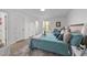 Bright bedroom featuring a cozy bed with stylish decor and natural light from a nearby window at 1208 Turner Farms Rd, Garner, NC 27529