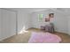 Bedroom with bright colors, a fluffy pink carpet, and a cute baby crib at 1208 Turner Farms Rd, Garner, NC 27529