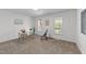 Comfortable bedroom with natural light, a desk, and view of the neighborhood at 1208 Turner Farms Rd, Garner, NC 27529