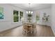 Elegant dining room with a chandelier and large windows at 1208 Turner Farms Rd, Garner, NC 27529