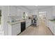 Functional kitchen with white cabinets, modern appliances, and ample counter space at 1208 Turner Farms Rd, Garner, NC 27529