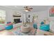 Airy living room with a white brick fireplace, plush seating, and decorative rug at 1208 Turner Farms Rd, Garner, NC 27529