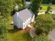 Beautiful aerial view of a two-story home with a manicured lawn and mature trees at 1222 Dixie Trl, Raleigh, NC 27607