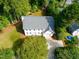 Expansive aerial view of a traditional home featuring lush landscaping and a private driveway at 1222 Dixie Trl, Raleigh, NC 27607