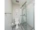 Modern bathroom featuring a glass enclosed shower, toilet and modern fixtures at 1222 Dixie Trl, Raleigh, NC 27607