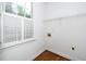 A walk-in closet features hardwood floors, bright windows, and metal shelving at 1222 Dixie Trl, Raleigh, NC 27607