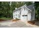 Charming two-story white brick home with attached garage and well-manicured front yard at 1222 Dixie Trl, Raleigh, NC 27607