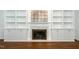 Close-up of fireplace with custom built-ins and hearth at 1222 Dixie Trl, Raleigh, NC 27607