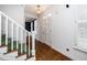 Bright foyer with hardwood floors, staircase, and an elegant chandelier at 1222 Dixie Trl, Raleigh, NC 27607