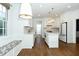 Modern kitchen with white cabinetry, stainless steel appliances, and ample counter space at 1222 Dixie Trl, Raleigh, NC 27607