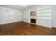 Spacious living room featuring a fireplace, built-ins, and natural light at 1222 Dixie Trl, Raleigh, NC 27607
