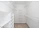 Spacious walk-in closet with multiple shelves for storage at 1222 Dixie Trl, Raleigh, NC 27607