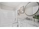 Bright bathroom with a shower-tub, white vanity, and modern fixtures at 125 Vance Wrenn Rd, Roxboro, NC 27573
