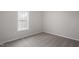 Bedroom with neutral walls, carpet, trim and a window letting in natural light at 125 Vance Wrenn Rd, Roxboro, NC 27573