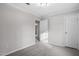 Bedroom with neutral walls and carpet as well as two closets at 125 Vance Wrenn Rd, Roxboro, NC 27573