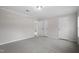 Bedroom featuring neutral walls, carpet, trim, and access to other rooms at 125 Vance Wrenn Rd, Roxboro, NC 27573