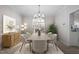 Elegant dining room featuring modern chandelier and seating for six at 125 Vance Wrenn Rd, Roxboro, NC 27573