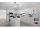 Bright kitchen with white cabinets, an island, and light blue backsplash at 125 Vance Wrenn Rd, Roxboro, NC 27573