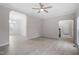 Spacious living area with light-colored wood flooring and arched doorways at 125 Vance Wrenn Rd, Roxboro, NC 27573