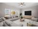 Comfortable living room with expansive sectional sofa, and large windows at 125 Vance Wrenn Rd, Roxboro, NC 27573