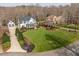 Stunning aerial view of a beautiful home with lush landscaping and mature trees at 1412 Wynncrest Ct, Raleigh, NC 27603