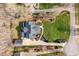 Stunning aerial view of a home with a beautifully landscaped yard and a spacious driveway and detached garage at 1412 Wynncrest Ct, Raleigh, NC 27603
