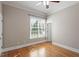 Bright bedroom features hardwood floors, crown molding and a ceiling fan at 1412 Wynncrest Ct, Raleigh, NC 27603