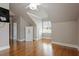 Spacious bedroom with hardwood floors, a window, and a Liberty safe in the corner at 1412 Wynncrest Ct, Raleigh, NC 27603