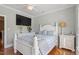 Bedroom with a queen size bed, tv and nautical decorations at 1412 Wynncrest Ct, Raleigh, NC 27603