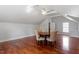 Spacious bonus room featuring beautiful wood flooring, neutral paint, and modern lighting at 1412 Wynncrest Ct, Raleigh, NC 27603